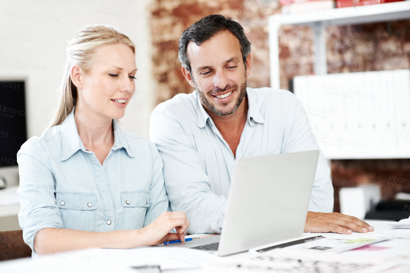 Buy stock photo Reading, laptop and meeting with business people in office for interior design, project and team. Blueprint review, architect brainstorming and online plan with employees for proposal and research