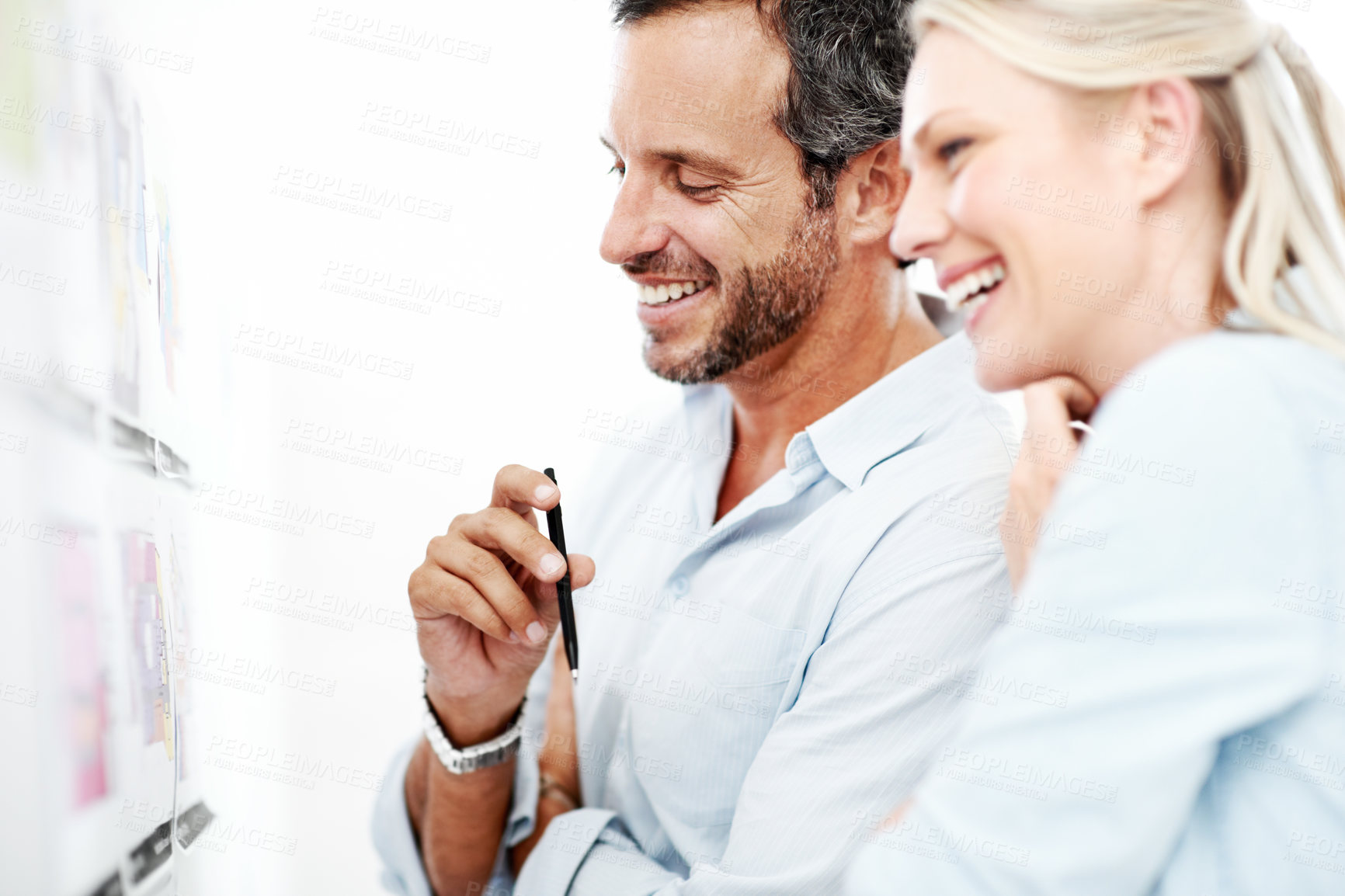 Buy stock photo Laughing, board and documents with business man in office for interior design, project and planning. Blueprint review, architect brainstorming and funny joke with employees in agency for proposal