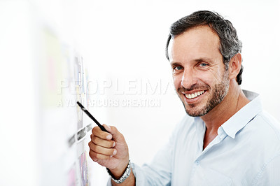 Buy stock photo Business man, portrait and blueprint on board, layout review and happy for architecture and strategy. Pointing, smile or architect with pen for floor plan, renovation overview and white background