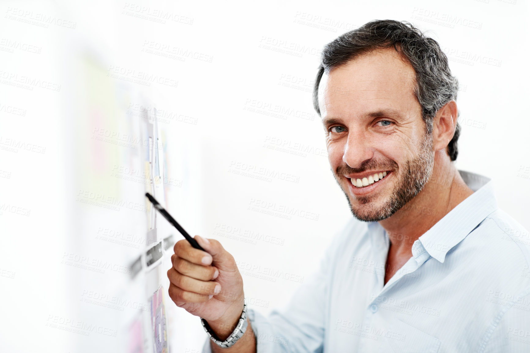 Buy stock photo Business man, portrait and blueprint on board, layout review and happy for architecture and strategy. Pointing, smile or architect with pen for floor plan, renovation overview and white background