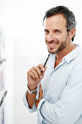 Buy stock photo Business man, happy and blueprint on board, layout review and architecture with strategy ideas. Portrait, design and male architect with pen for floor plan, renovation overview and white background