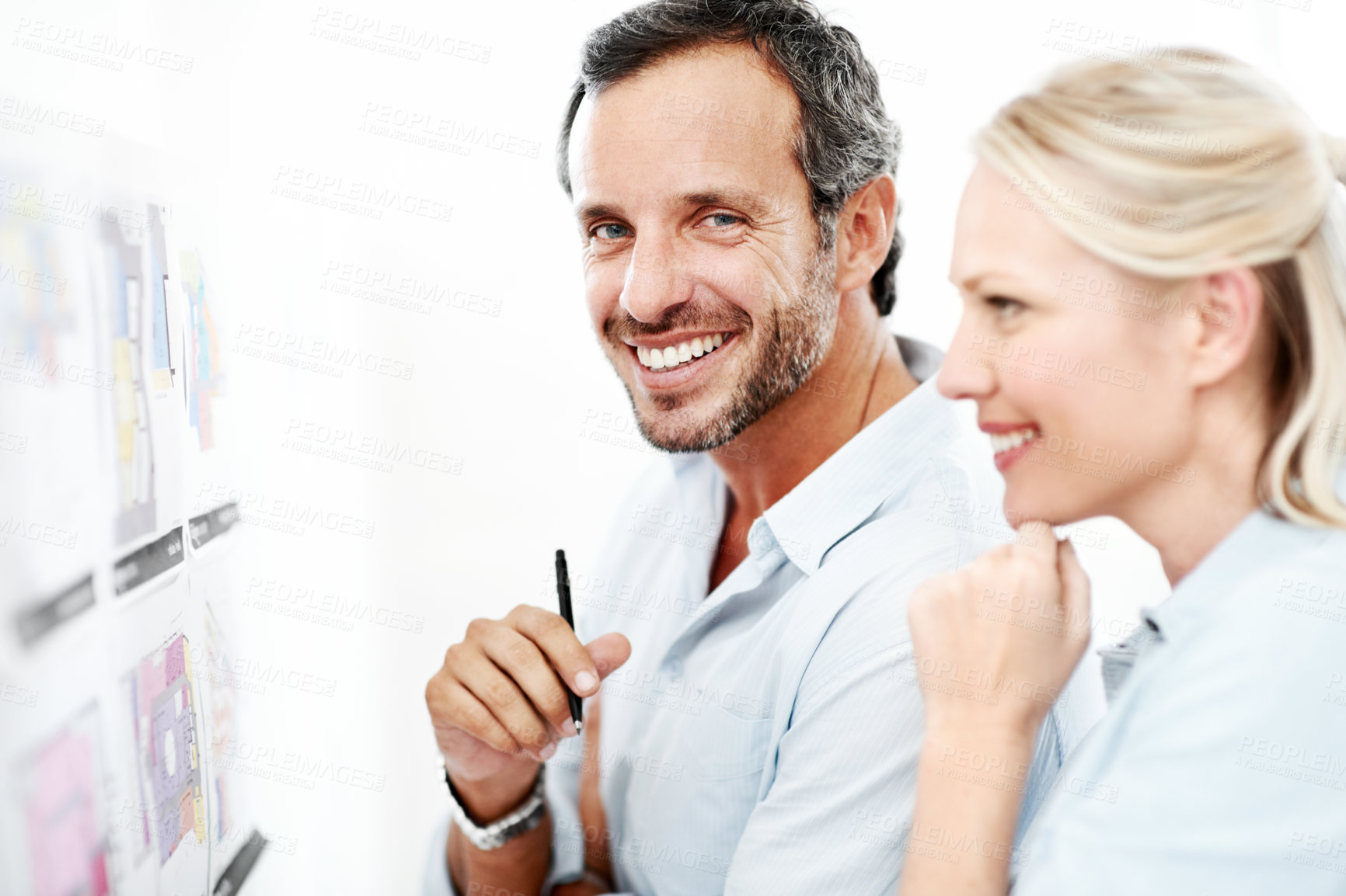 Buy stock photo Planning, board and documents with business people in office for design, project and team. Blueprint review, architect brainstorming and portrait of happy employee in agency for proposal and meeting