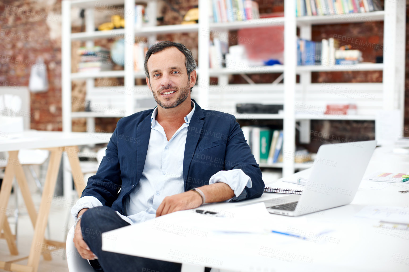 Buy stock photo Businessman, smile and portrait at startup for architecture, civil engineering and laptop for design. Mature architect, blueprint planning with contractor, happy employee and confidence in workplace