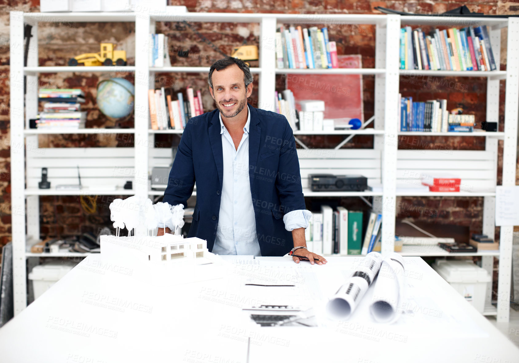 Buy stock photo Happy man, business and portrait at startup for architecture, civil engineering and design agency. Architect, mature person and building model, contractor or employee with confident smile in office