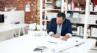 Buy stock photo Architecture, drawing and man in office with model for civil engineering, design or review. Architect, mature person and blueprint planning, contractor or employee with sketching paperwork at agency