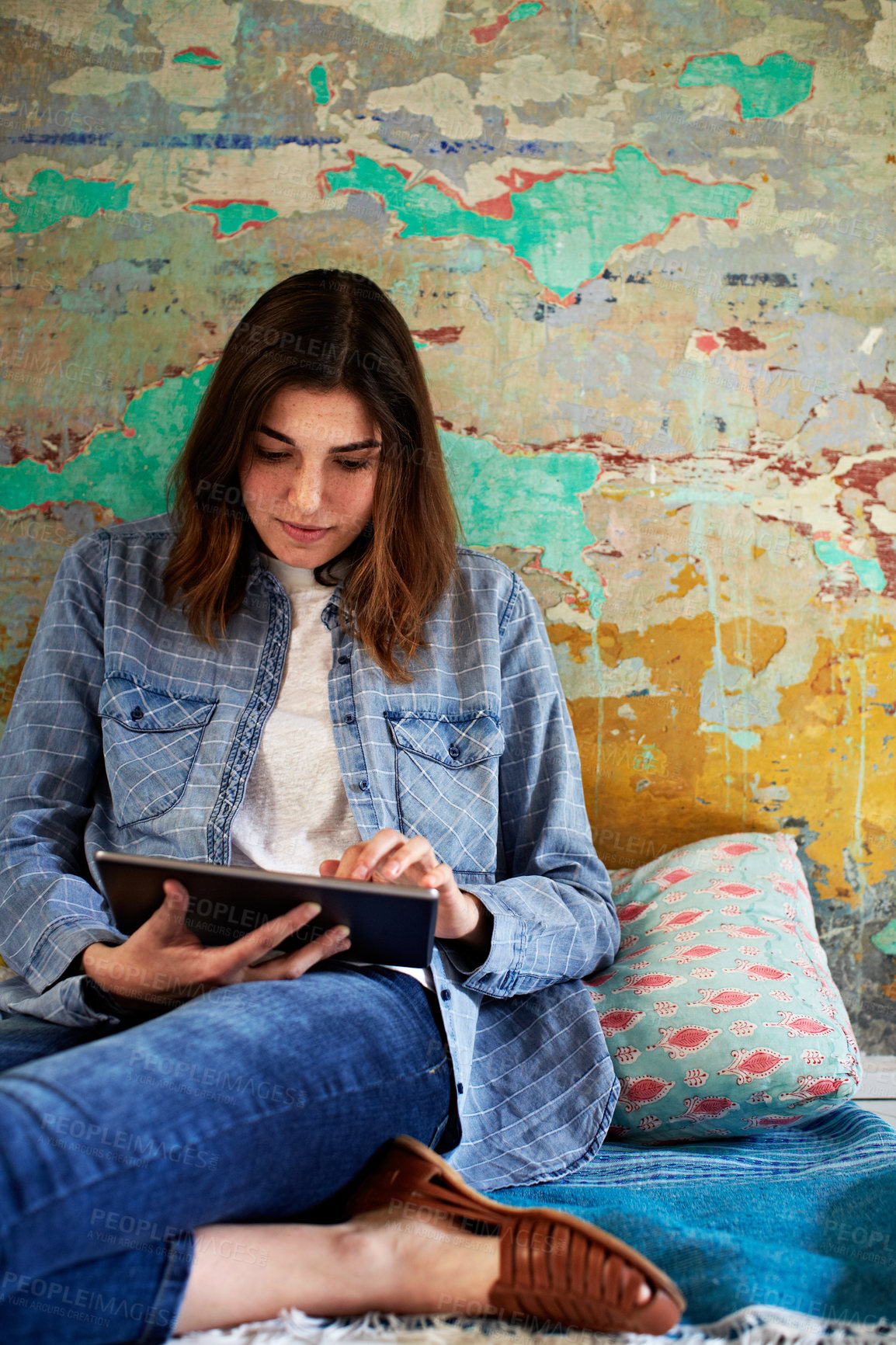 Buy stock photo Woman, tablet and relax in home with scroll, update and subscription for ebook or social media. Person, digital tech and reading on floor for notification, app post and streaming video in house