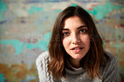 Buy stock photo Portrait of a young woman posing in front of a colorful wall