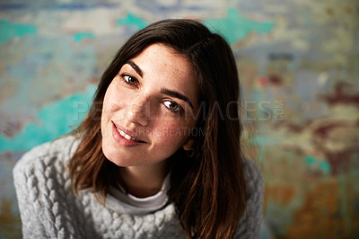 Buy stock photo Portrait of a young woman posing in front of a colorful wall