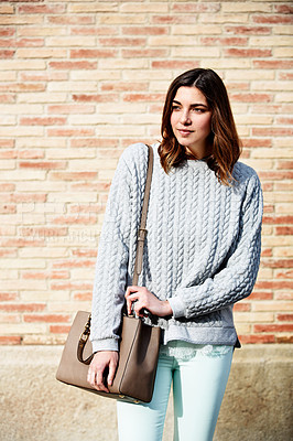 Buy stock photo Shot of a casually dressed young woman spending a day outdoors