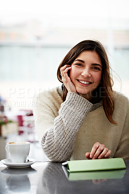 Buy stock photo Portrait of a young woman sitting in a coffee shop
