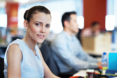 Buy stock photo Portrait of a young professional at work at her desk in an office