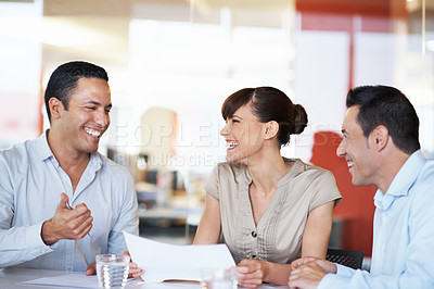 Buy stock photo Shot of coworkers discussing paperwork in a meeting