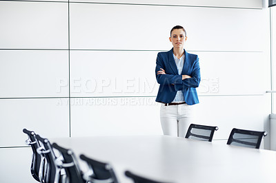 Buy stock photo Portrait of a young businesswoman standing in a conference room