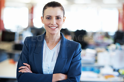 Buy stock photo Portrait of an attractive young businesswoman standing in an office