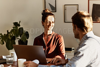 Buy stock photo Shot of a couple working together at home