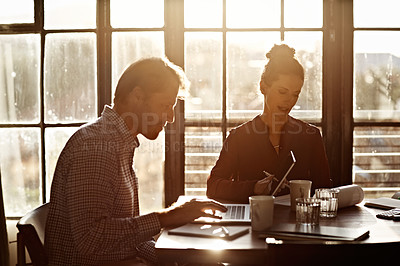 Buy stock photo Shot of a couple working together at home