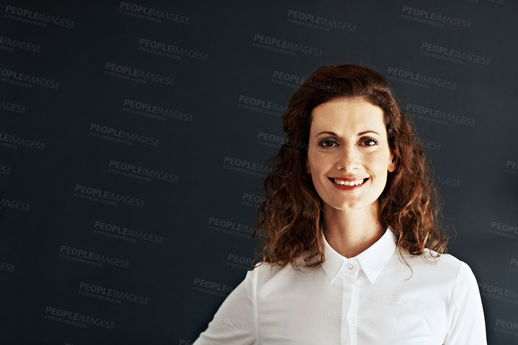 Buy stock photo Studio portrait of a businesswoman against a gray background