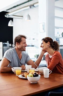 Buy stock photo Shot of a mature couple having breakfast together