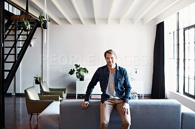 Buy stock photo Portrait of a mature man leaning on a sofa in his living room