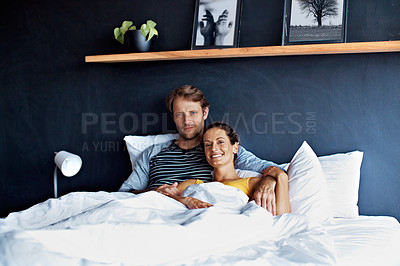 Buy stock photo Portrait of a content mature couple lying in bed together