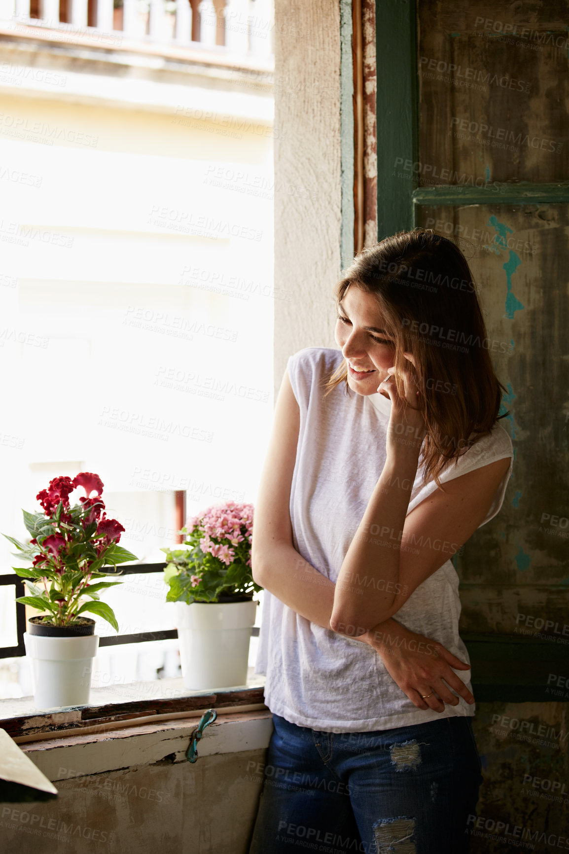 Buy stock photo Woman, smile and phone call in home, window and communication with contact on weekend or discussion. Happy person, laugh and funny conversation with mobile, chilling and listening to gossip in house
