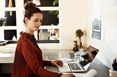 Buy stock photo Shot of a businesswoman at work on a laptop in an office