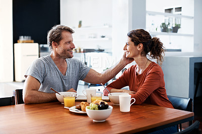 Buy stock photo Shot of a mature couple enjoying breakfast together