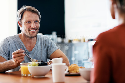 Buy stock photo Shot of a mature couple enjoying breakfast together