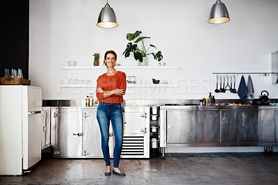 Buy stock photo Portrait of a smiling mature woman standing in her kitchen
