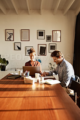 Buy stock photo Shot of a couple working together at home