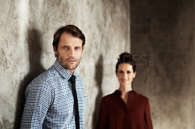 Buy stock photo Portrait of a man with his wife standing in the background