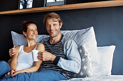 Buy stock photo Portrait of a smiling mature couple sitting in bed