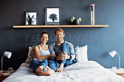 Buy stock photo Portrait of a smiling mature couple sitting in bed