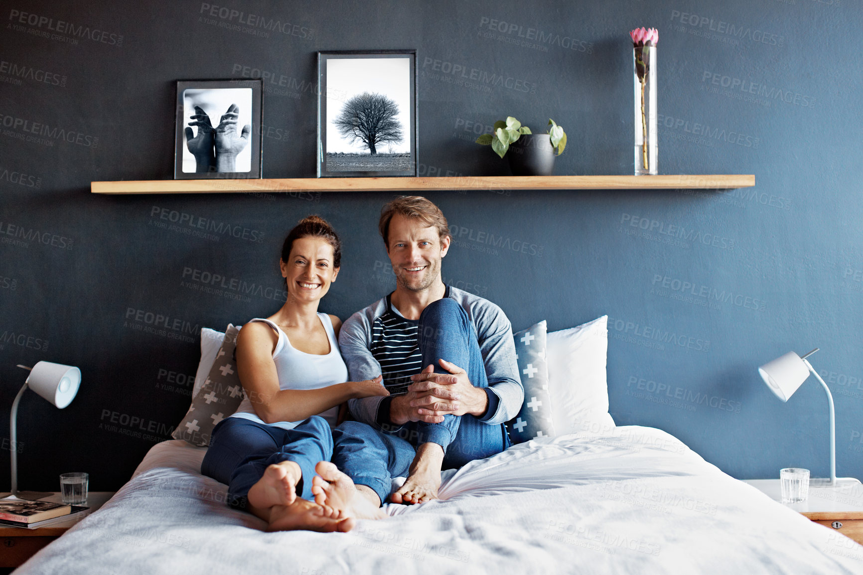 Buy stock photo Portrait, couple and happy in bedroom for support, care and commitment with relationship in home. Love, man and woman for connection, relax and trust in marriage with morning together in house