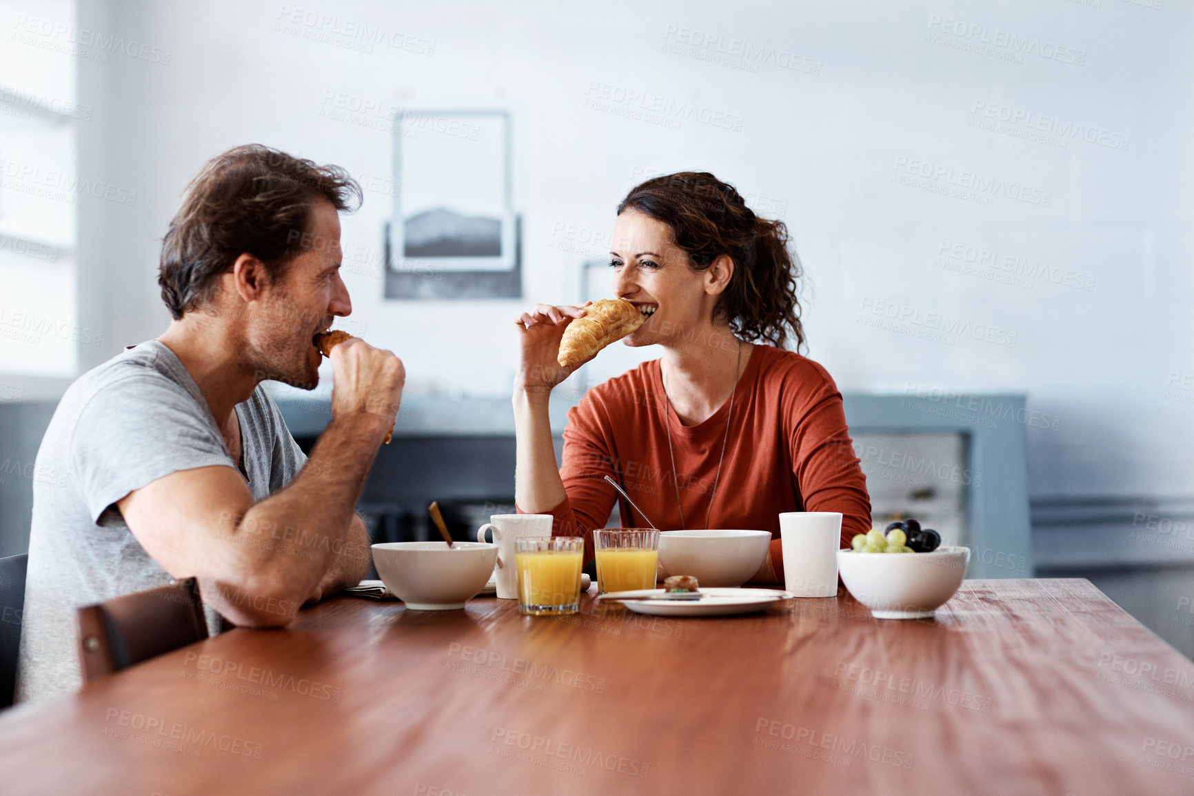 Buy stock photo Shot of a mature couple enjoying breakfast together