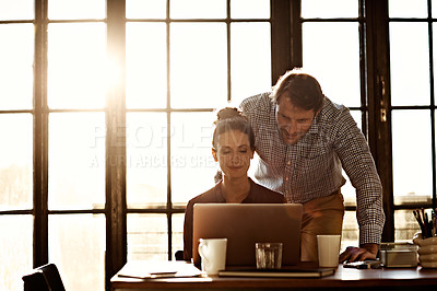 Buy stock photo Shot of a mature couple working on a laptop together at home