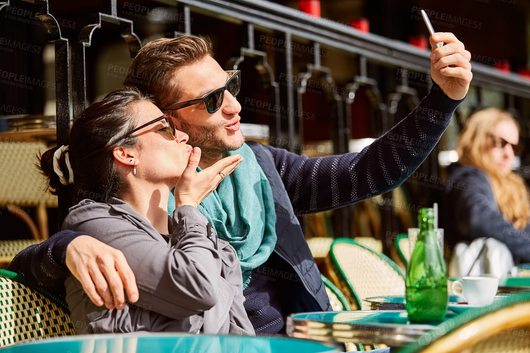 Buy stock photo Happy, couple and cafe with selfie for travel, weekend getaway or romantic vacation together. Man, woman or blowing kiss with smile for capture moment, photography or picture in restaurant or town
