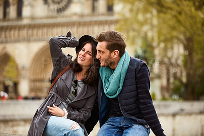 Buy stock photo Shot of a young couple enjoying the day together in the city