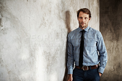 Buy stock photo Portrait of a businessman in a shirt and tie leaning against a wall