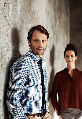 Buy stock photo Portrait of two businesspeople standing against a wall