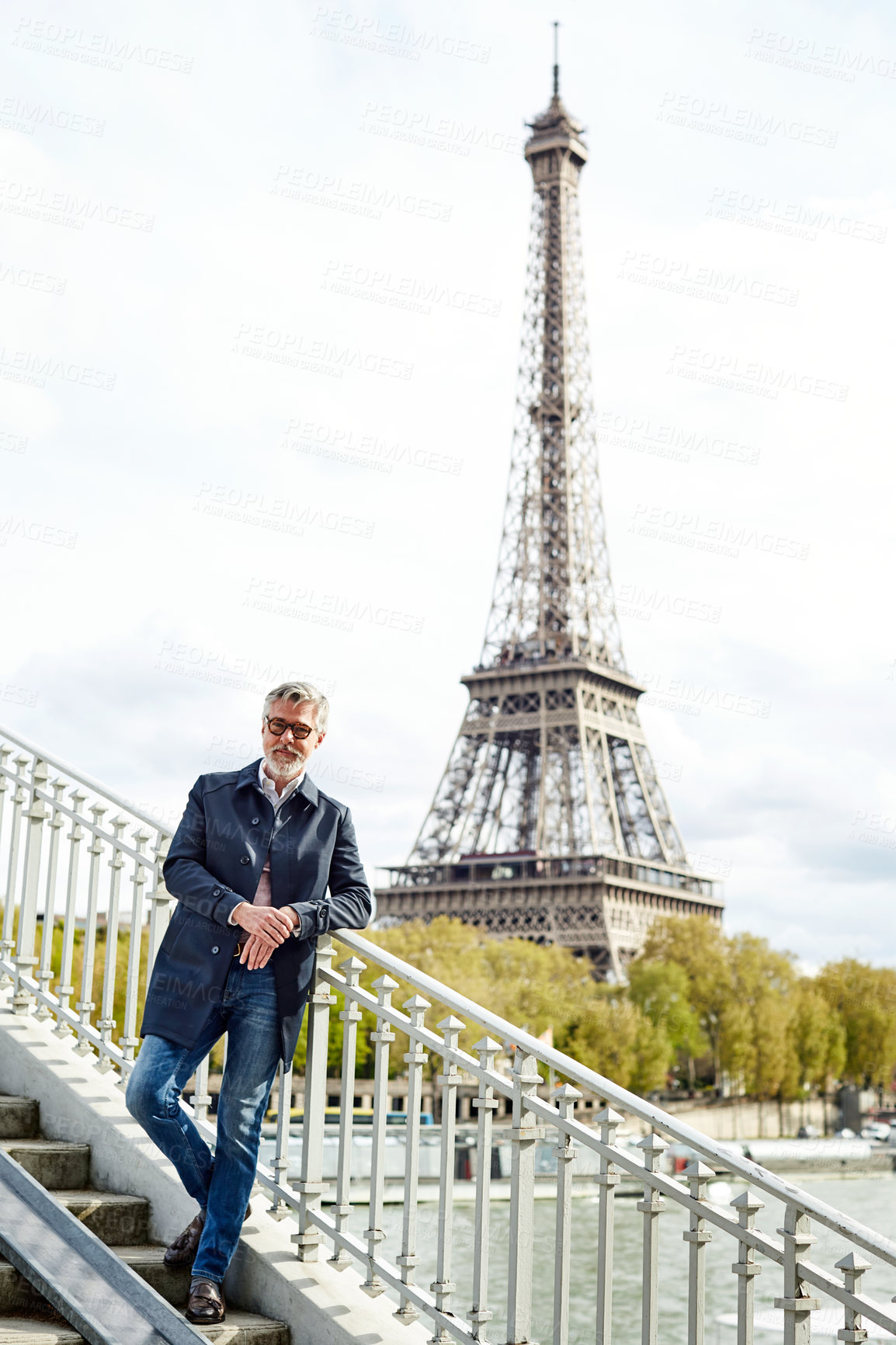 Buy stock photo Portrait of a handsome mature man with the Eiffel Tower in the background