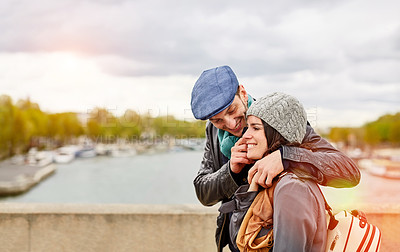 Buy stock photo Shot of a smiling young couple walking together in the streets of Paris