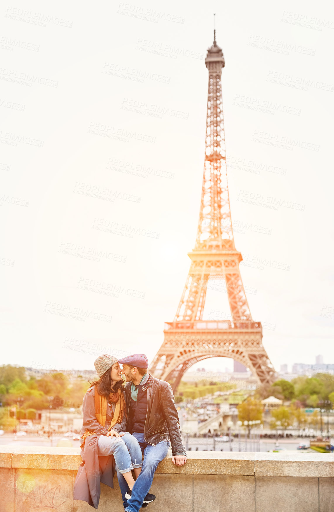 Buy stock photo Travel, couple or laugh at Eiffel tower with love, vacation sightseeing or bucket list trip in city. Man, woman or nose touch at national landmark for bonding, honeymoon or space with view in Paris