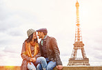 Kissing under the shadow of the Eiffel Tower