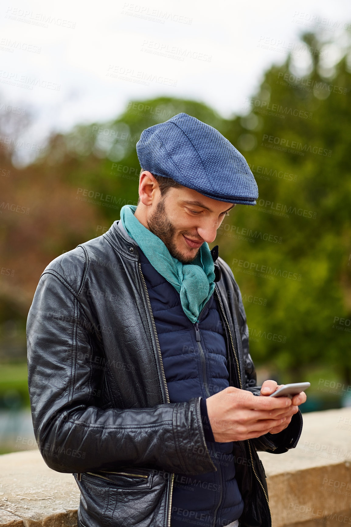 Buy stock photo Texting, smile and man in town with phone, online communication and post reaction on social media. Digital, bokeh and person outdoor with technology, message response or chatting on virtual platform.