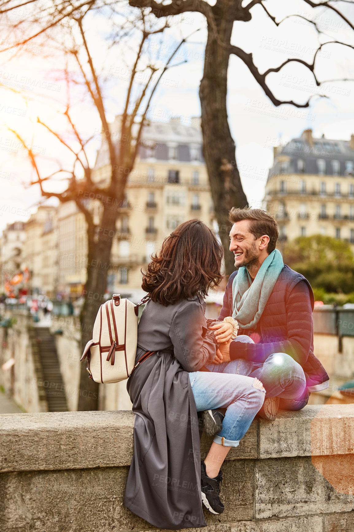 Buy stock photo Love, vacation and happy couple in city on bridge with connection, trust and relax together. Smile, man and woman outdoor with care, bonding or conversation with partner on tourist holiday in Paris