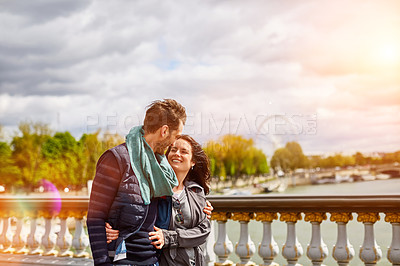 Buy stock photo Shot of a smiling young couple walking together in the streets of Paris