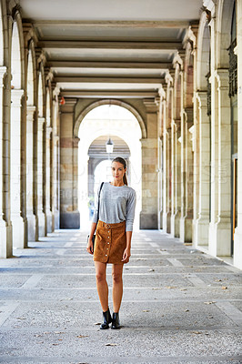 Buy stock photo Portrait of a stylish young woman walking in the city