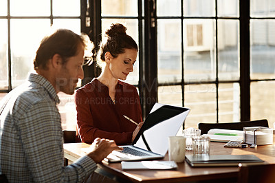 Buy stock photo Shot of a mature couple working together at home