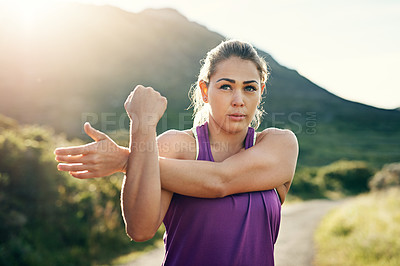 Buy stock photo Shot of a friends stretching before a run on a cool morning